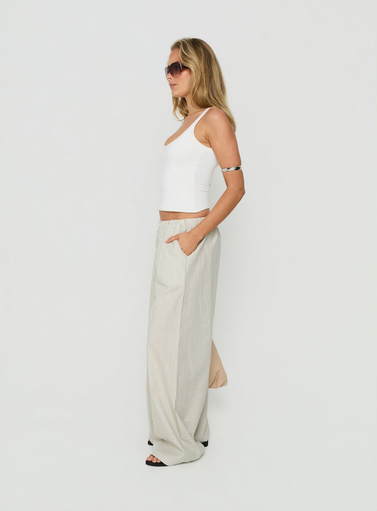 Crafted for comfort, the Lunea Concealed Waistband Pants Pinstripe womens regular pants in mid-rise side view of model wearing Princess Polly