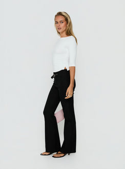 Featuring the Viridian Belted Flared Pants Black womens-regular-pants with high-rise waist on-body view of model wearing Princess Polly