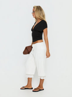 side view of model wearing Princess Polly Basma Bloomer Trouser Pants Rayon White Mid Rise Pants Pants 