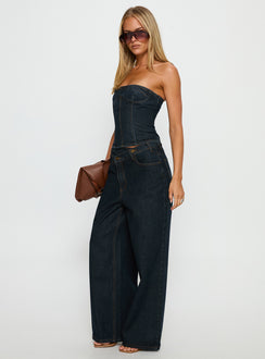 side view of model wearing Princess Polly Blue Crush Low Rise Wide Leg Jeans Indigo Mid Rise Jeans Jeans 
