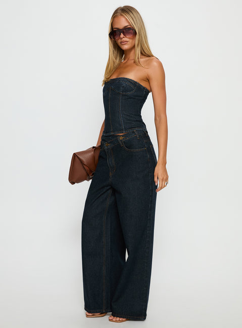 side view of model wearing Princess Polly Blue Crush Low Rise Wide Leg Jeans Indigo Mid Rise Jeans Jeans 