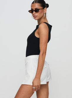 side view of model wearing Princess Polly Deuce Split Skort White High Waisted Shorts 