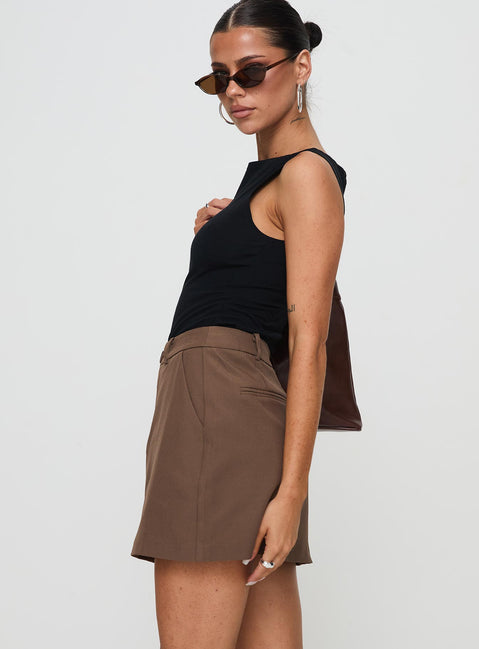   side view of model wearing Princess Polly Sabyna Tailored Mini Skirt Brown Mini Skirts Skirts 