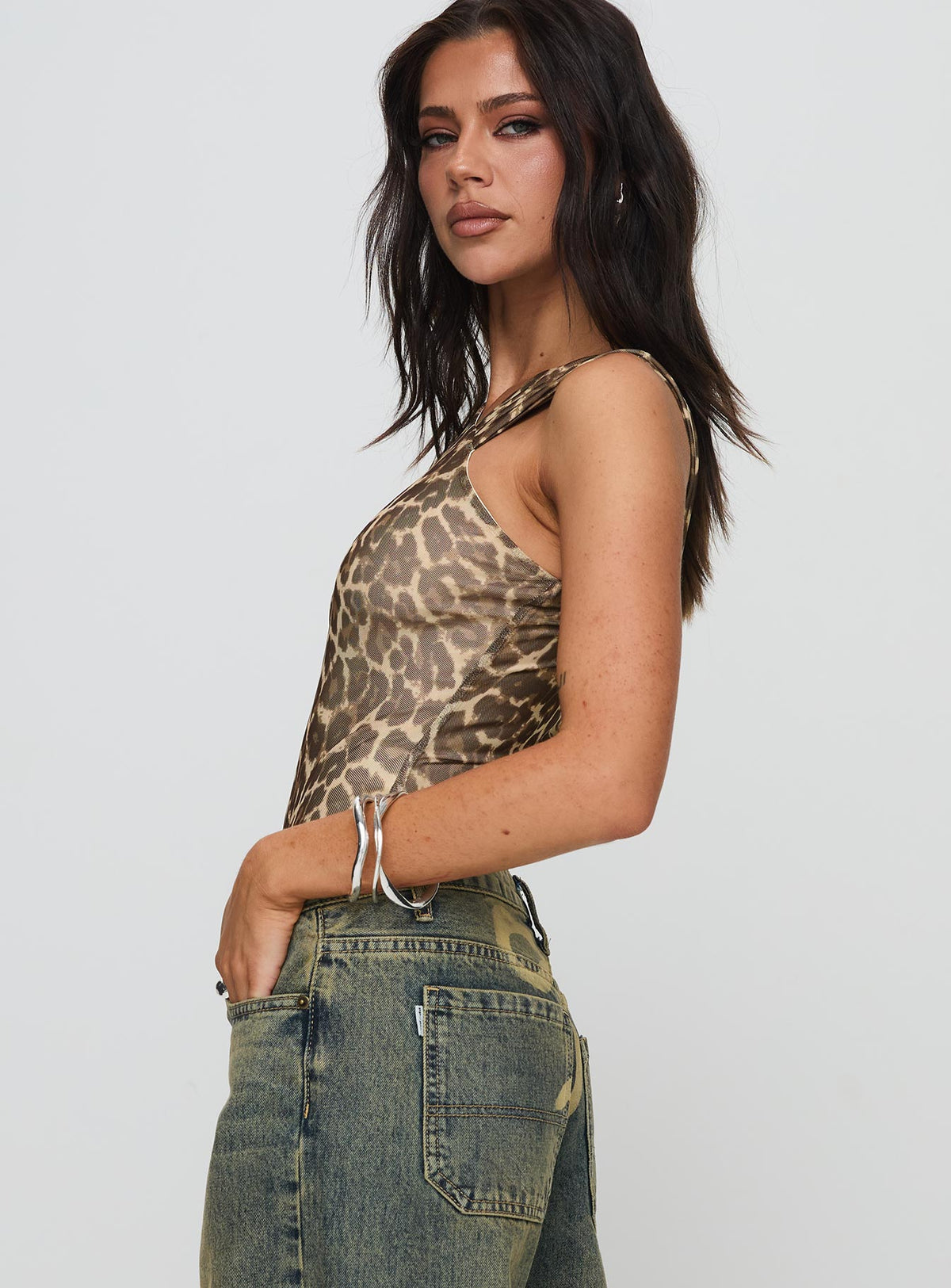 side view of model wearing Princess Polly Serenata Bodysuit Leopard Sleeveless Bodysuit 