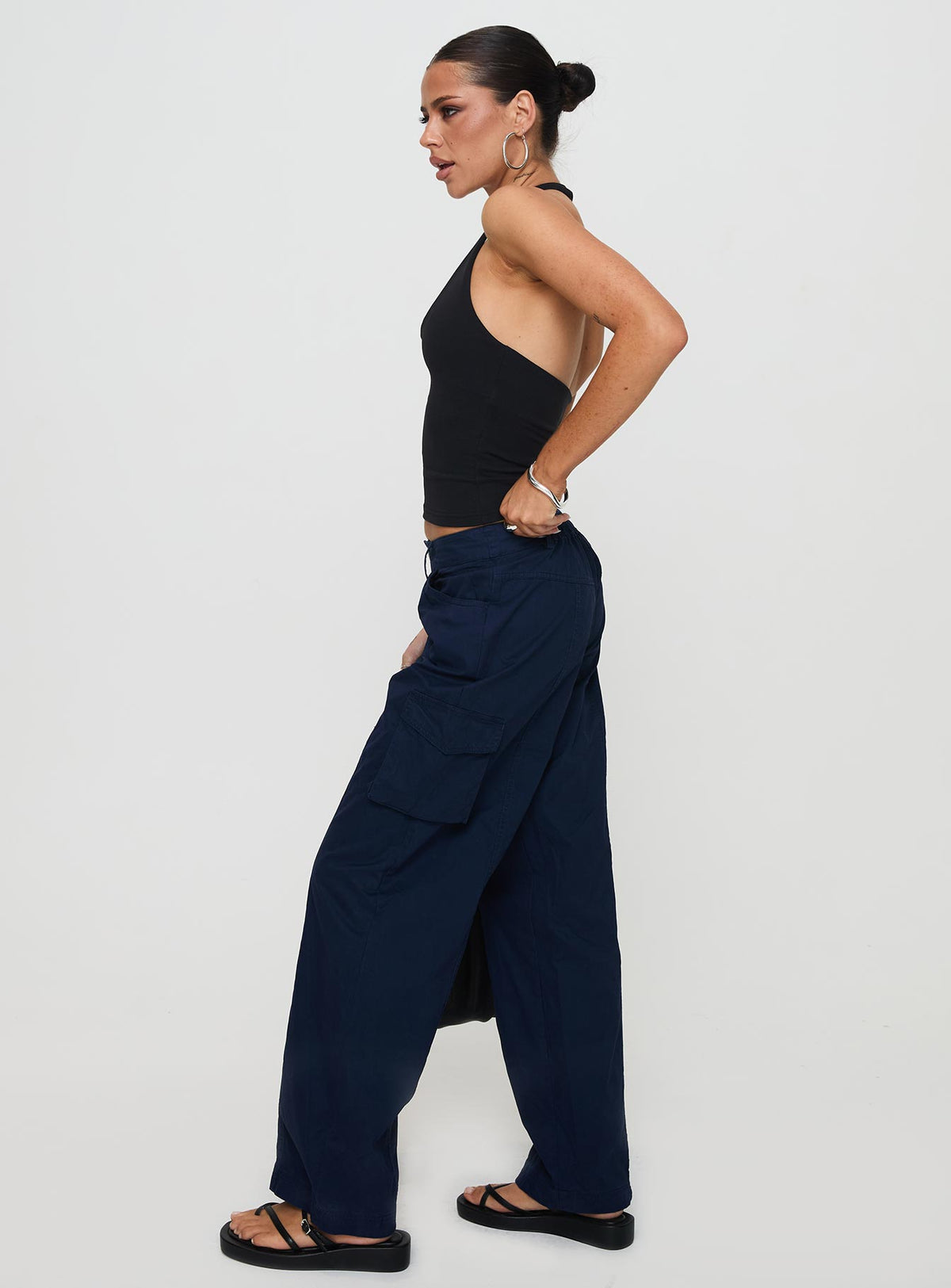 side view of model wearing Princess Polly Major General Cargo Pant Navy Low Rise Pants Pants 