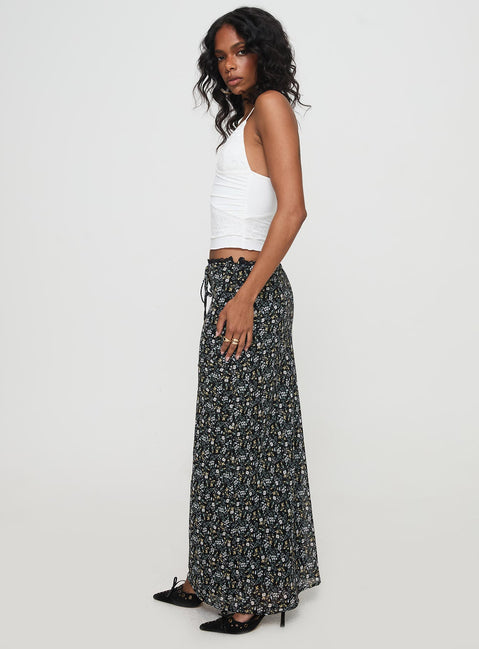   side view of model wearing Princess Polly Emily Maxi Skirt Blue / Black Floral Maxi Skirts Skirts 
