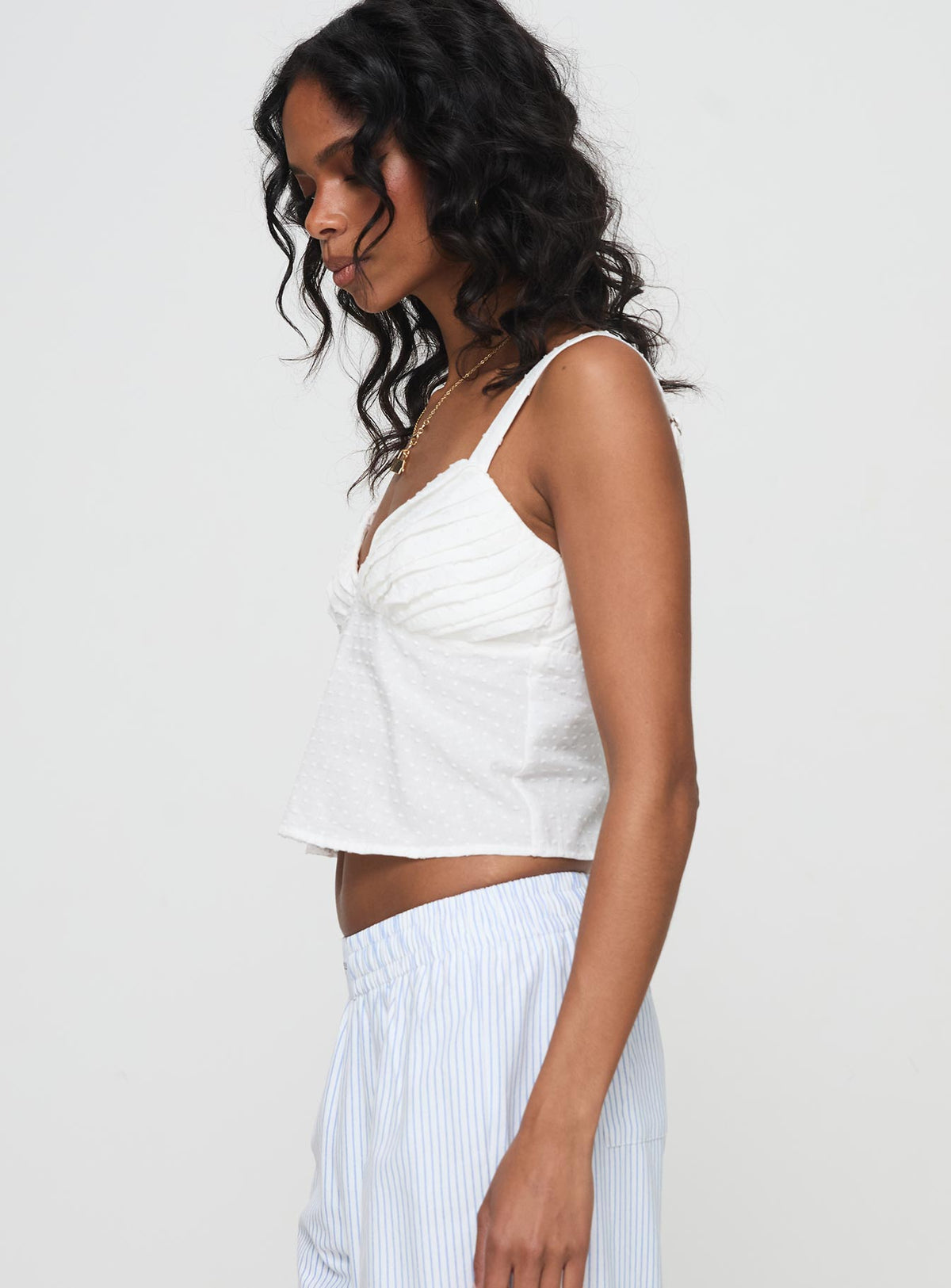 side view of model wearing Princess Polly Prevost Cami Top White Sleeveless V-Neck 