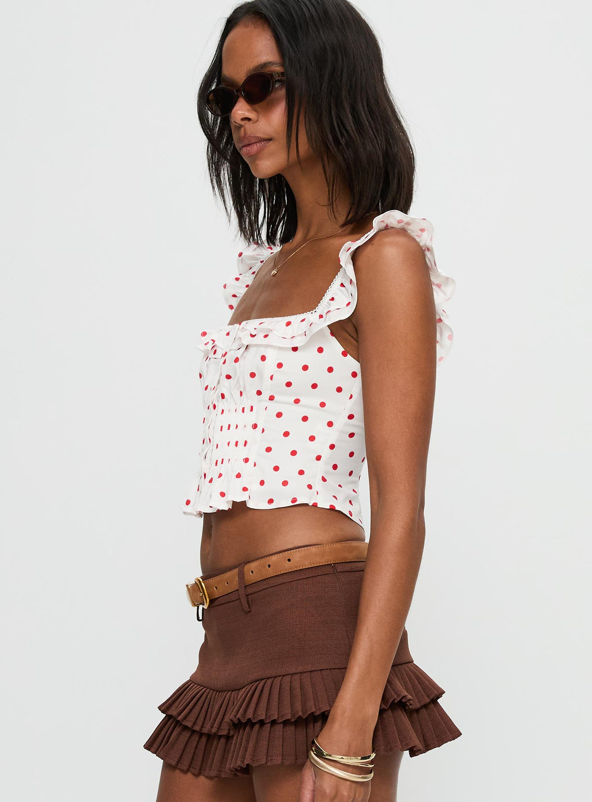 side view of model wearing Princess Polly Isadoria Frill Top White / Red Polka Sleeveless Square Neck 