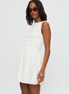 side view of model wearing Princess Polly Melona Shirred Mini Dress White Boat Neck 