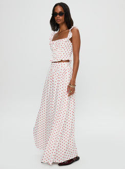   side view of model wearing Princess Polly Valerio Maxi Skirt White / Red Maxi Skirts Skirts 