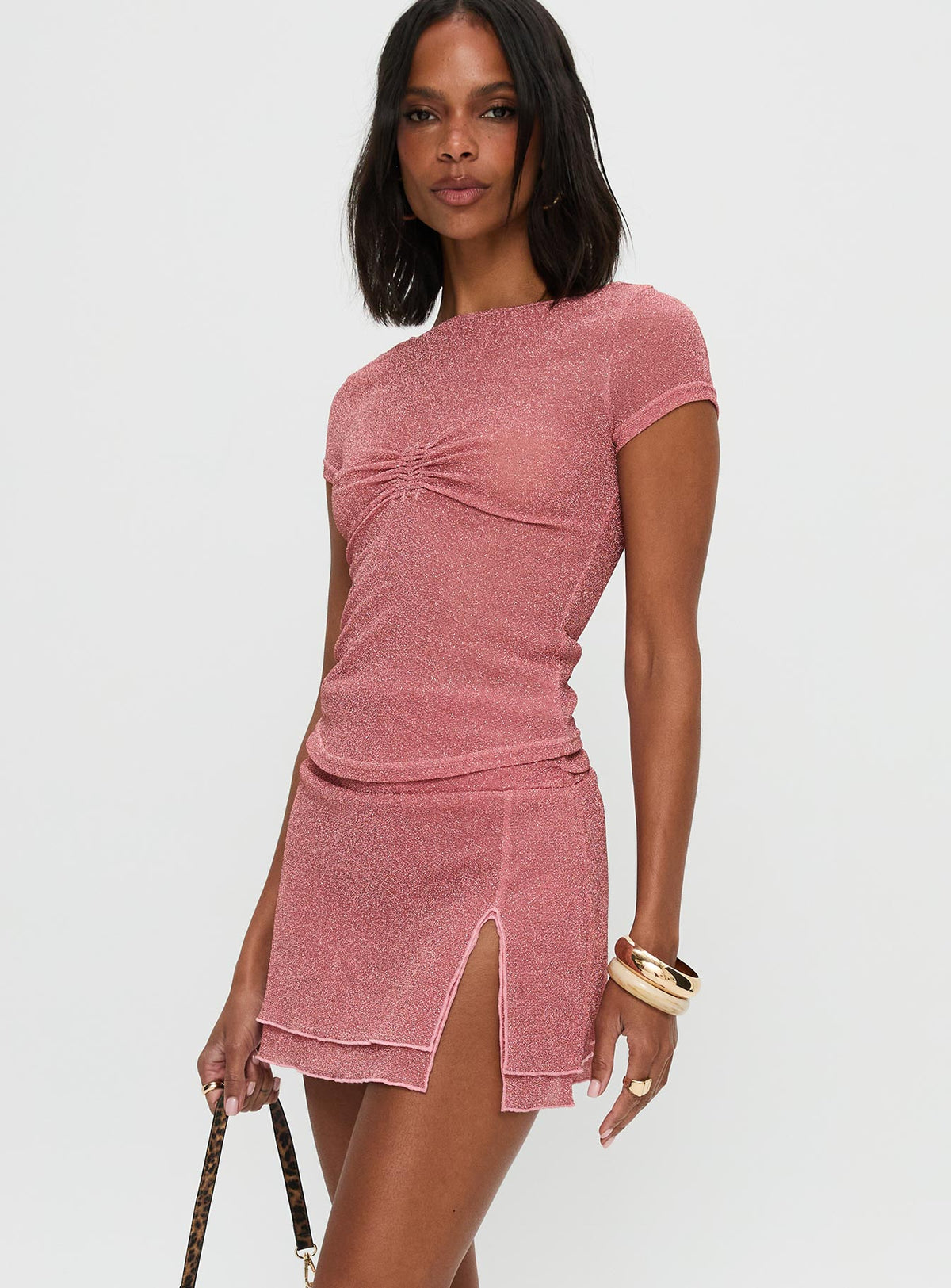   side view of model wearing Princess Polly Flattered Shimmer Mini Skirt Pink Mini Skirts 