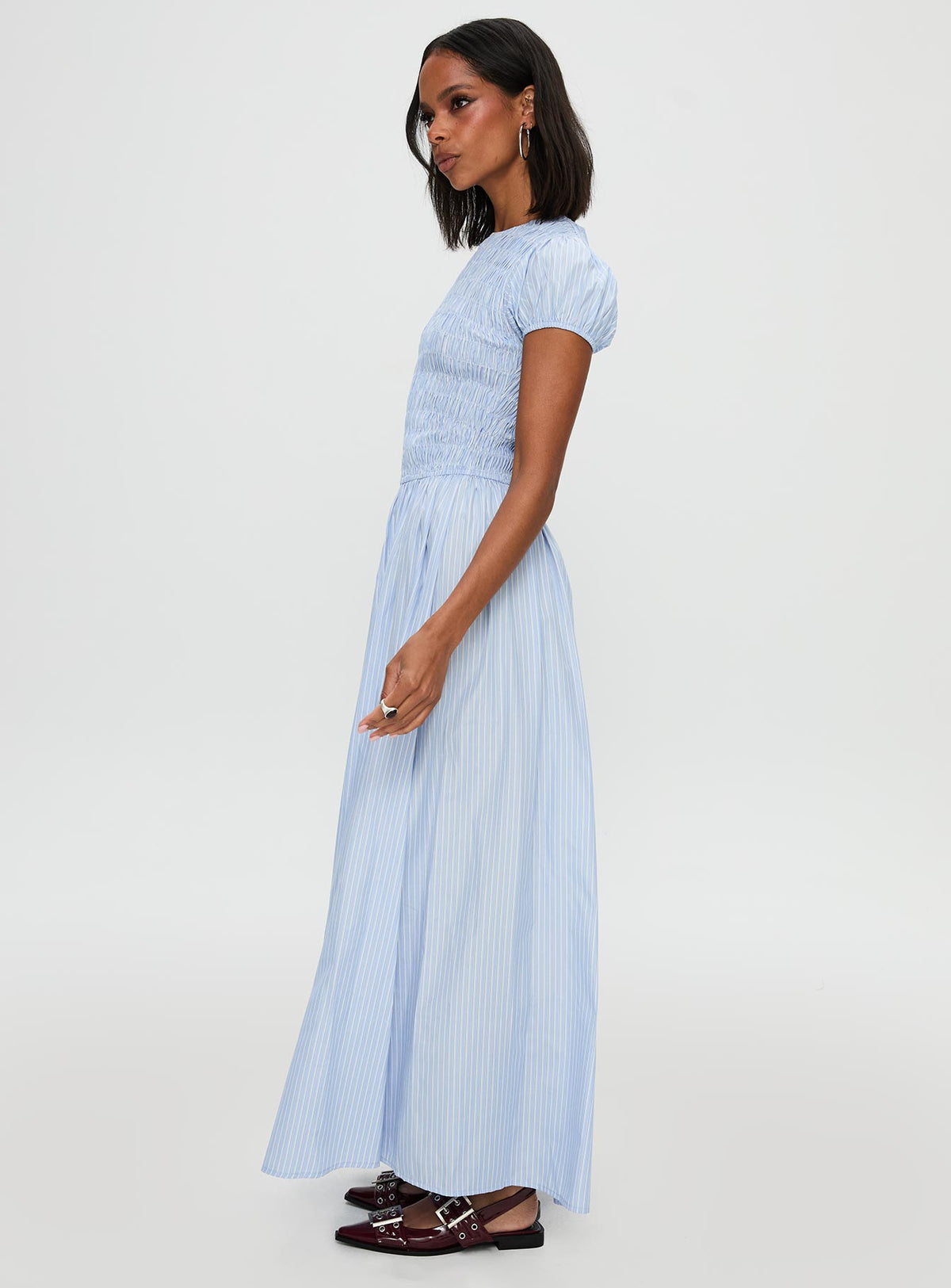 side view of model wearing Princess Polly Wendelin Shirred Maxi Dress Blue Stripe Crew Neck 