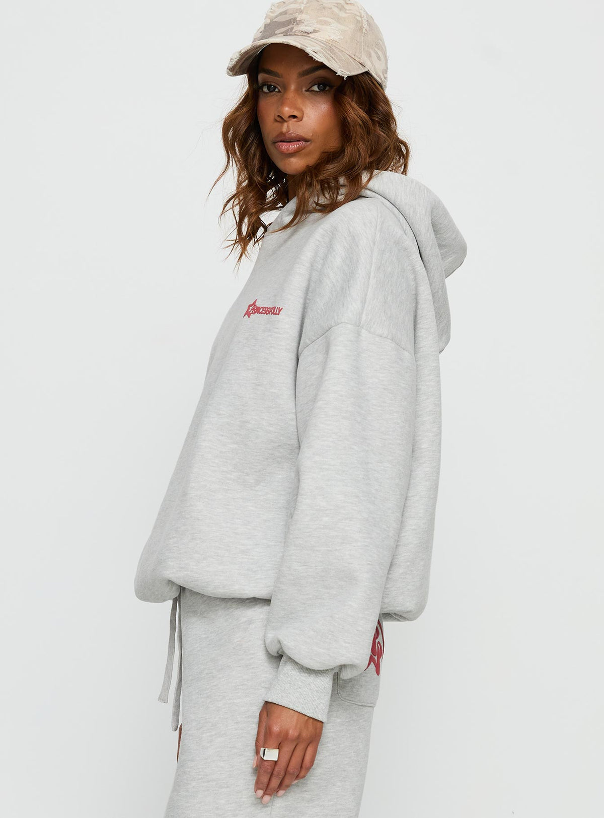 Featuring the Stargirl Hoodie Grey Marle womens jumpers with long length side view of model wearing Princess Polly