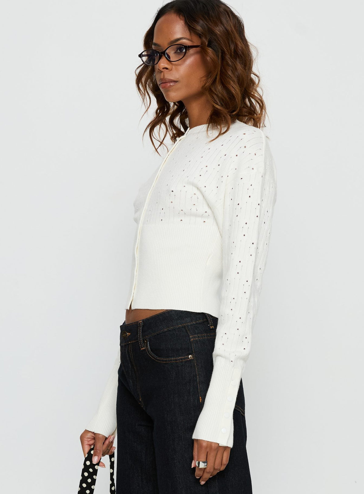 side view of model wearing Princess Polly Head In The Clouds Cardigan Cream cropped Jumpers 