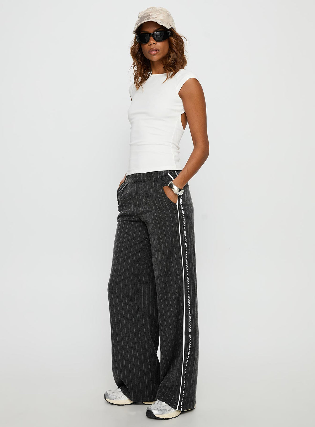 side view of model wearing Princess Polly Knowla Pleated Trouser Pant Grey Pinstripe Mid Rise Pants Pants 