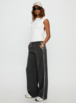 side view of model wearing Princess Polly Knowla Pleated Trouser Pant Grey Pinstripe Mid Rise Pants Pants 