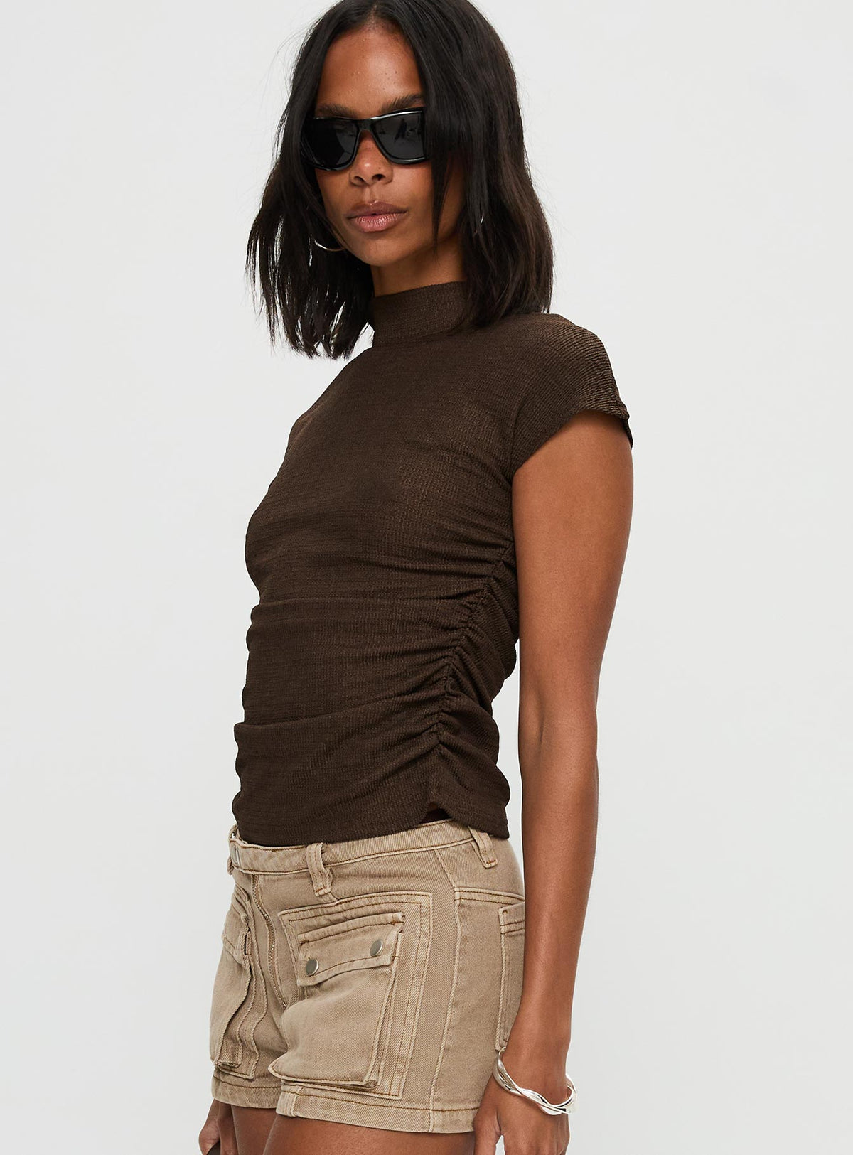 side view of model wearing Princess Polly Make A Plan Top Brown Short Sleeves High Neck 