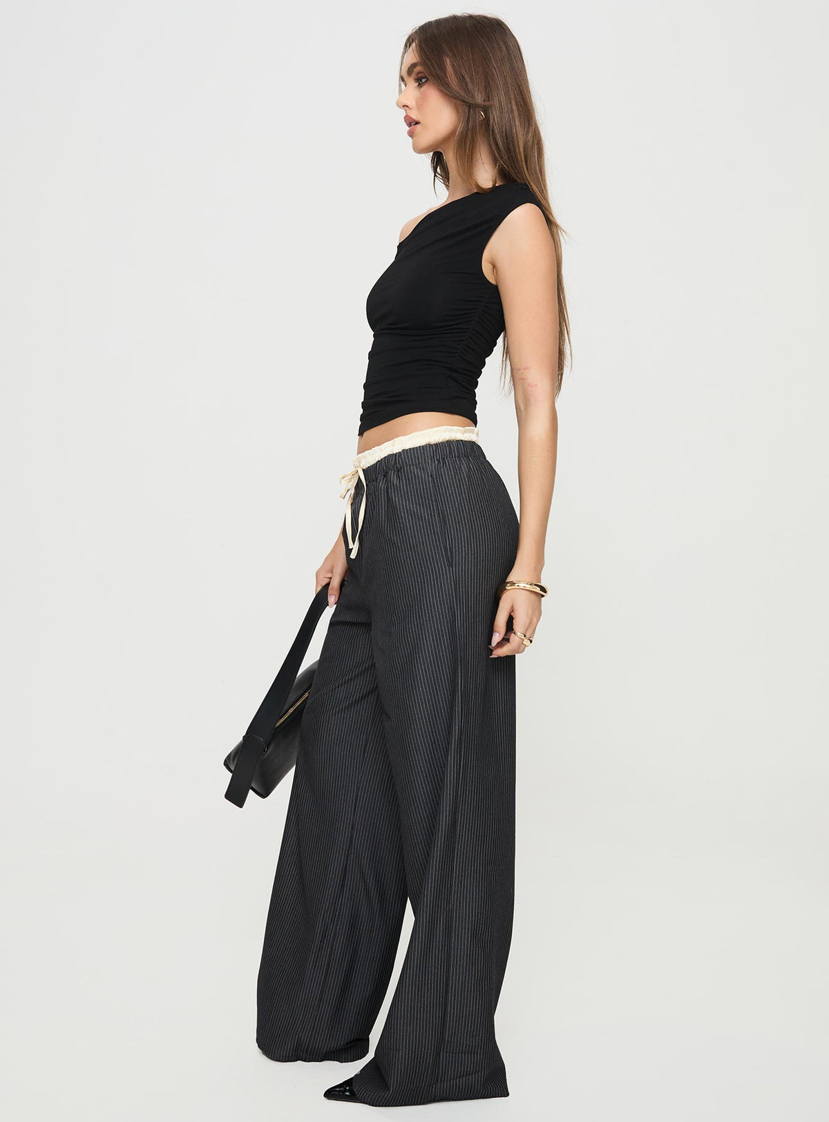 side view of model wearing Princess Polly Seraphic Pants Charcoal Stripe High Rise Pants Pants 