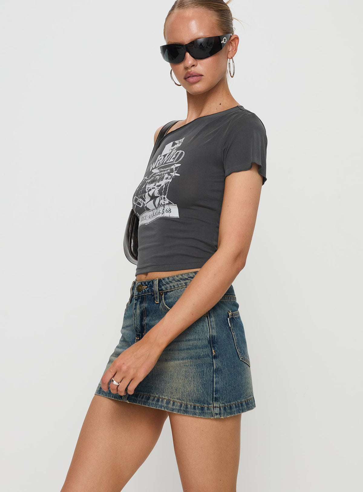   side view of model wearing Princess Polly Ribbon Stamp Mini Skirt Antique Wash Mini Skirts Skirts 