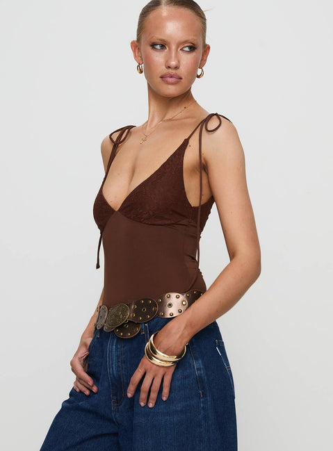 side view of model wearing Princess Polly Prichard Bodysuit Brown Sleeveless Bodysuit 
