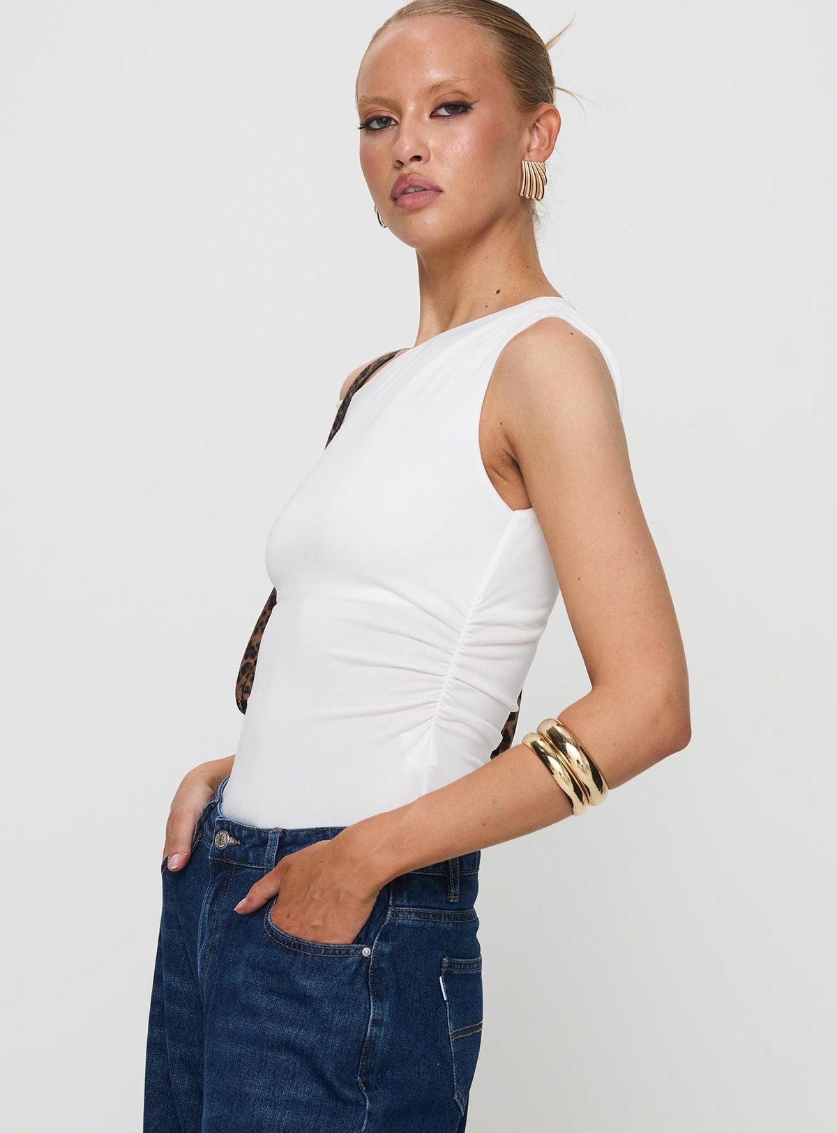 side view of model wearing Princess Polly Miyako Bodysuit White Sleeveless Bodysuit 