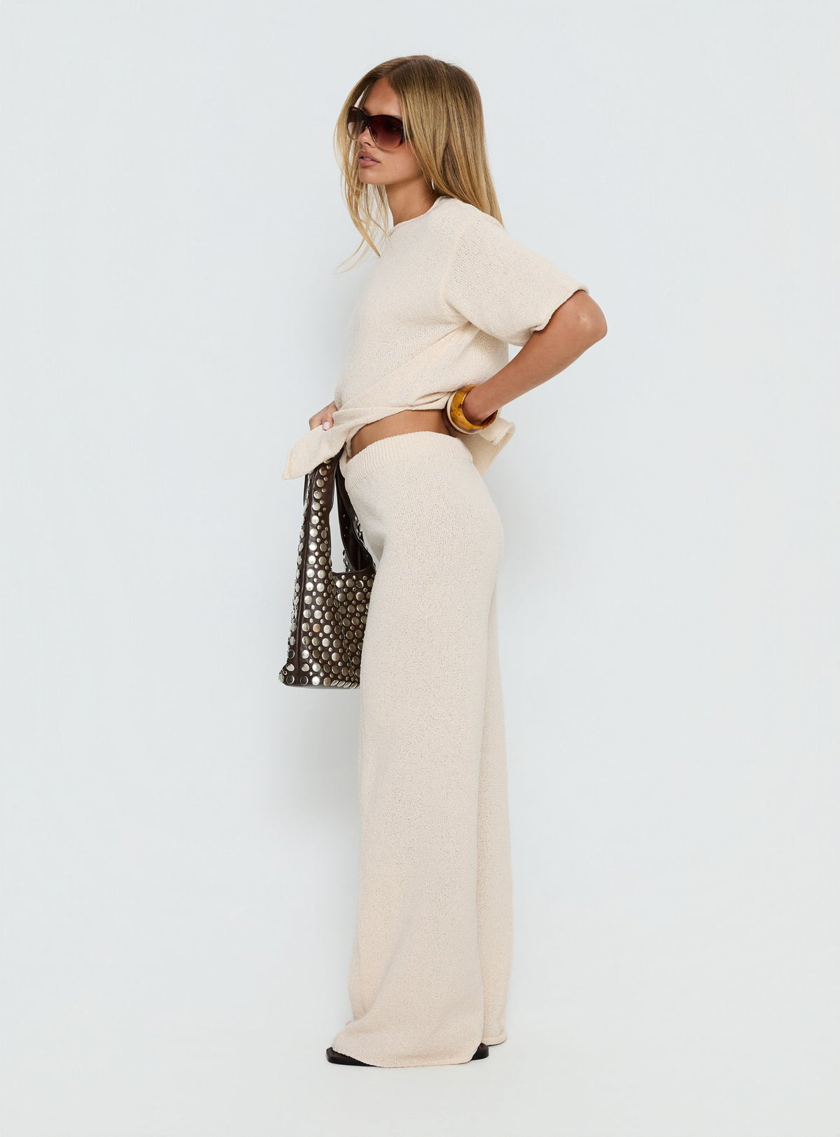 side view of model wearing Princess Polly Calisse Knit Wide Leg Pants Beige High Rise Pants Pants 