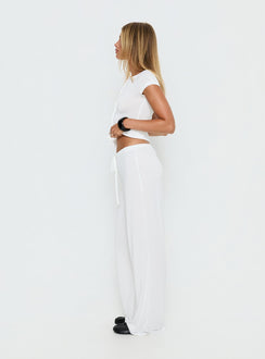 side view of model wearing Princess Polly Gavrielle Jersey Wide Leg Pants White Mid Rise Pants Pants 