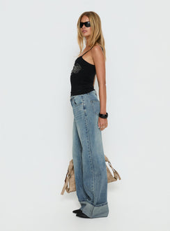 side view of model wearing Princess Polly Ezia Wide Cuff Baggy Jeans Raw Denim Mid Rise Jeans Jeans 
