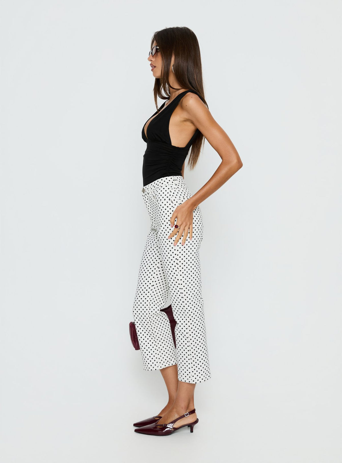 side view of model wearing Princess Polly Cindee High Rise Cropped Jeans White Polka Dot High Rise Jeans Jeans 