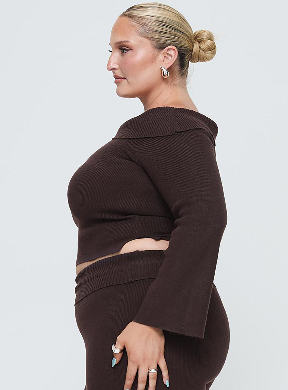 side view of model wearing Princess Polly Sina Off The Shoulder Top Chocolate Curve Cropped Jumpers Jumpers 