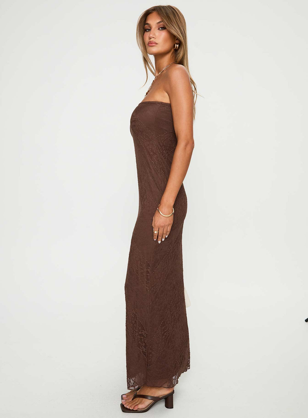side view of model wearing Princess Polly Majorca Strapless Maxi Dress Chocolate Straight Neck 
