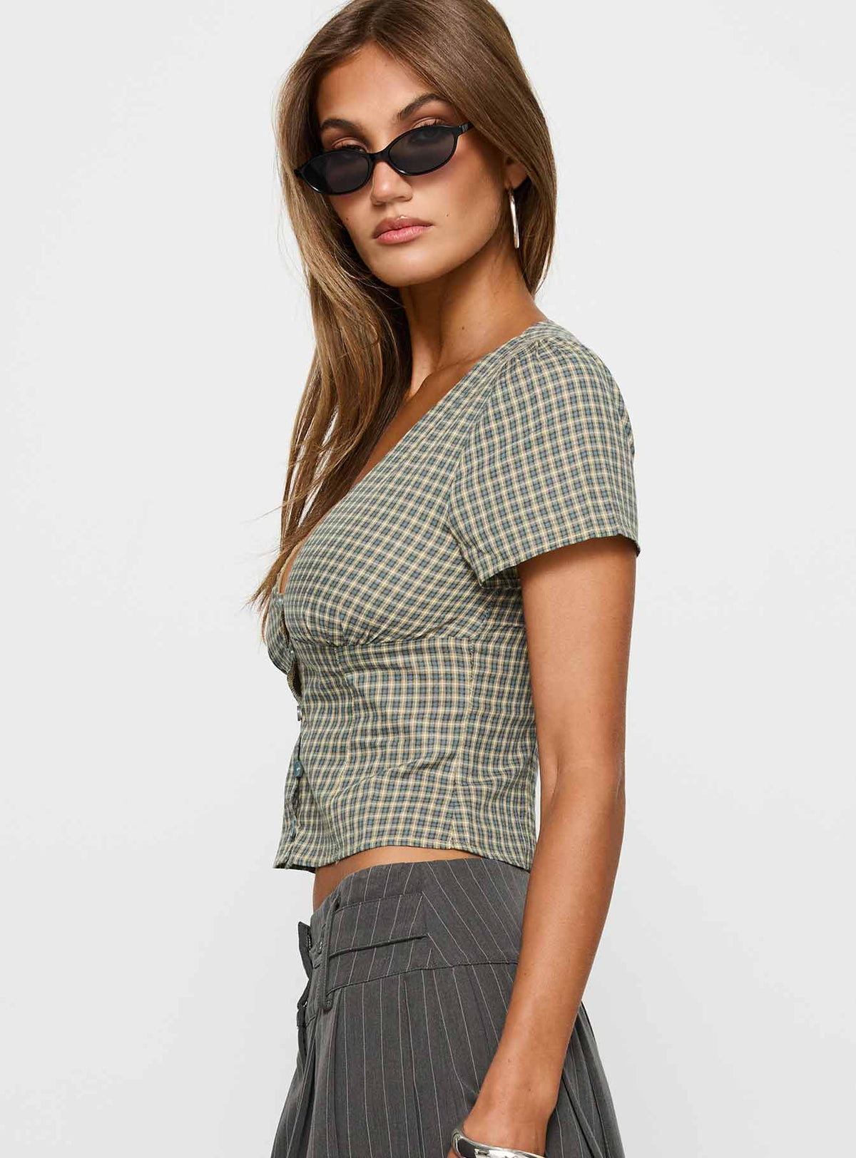side view of model wearing Princess Polly Isolda Top Multi Check Short Sleeves Plunger 