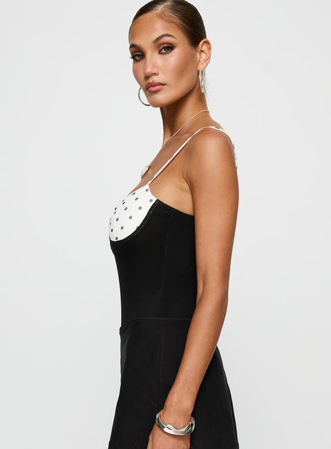side view of model wearing Princess Polly Evette Bodysuit Black / White Sleeveless Bodysuit 
