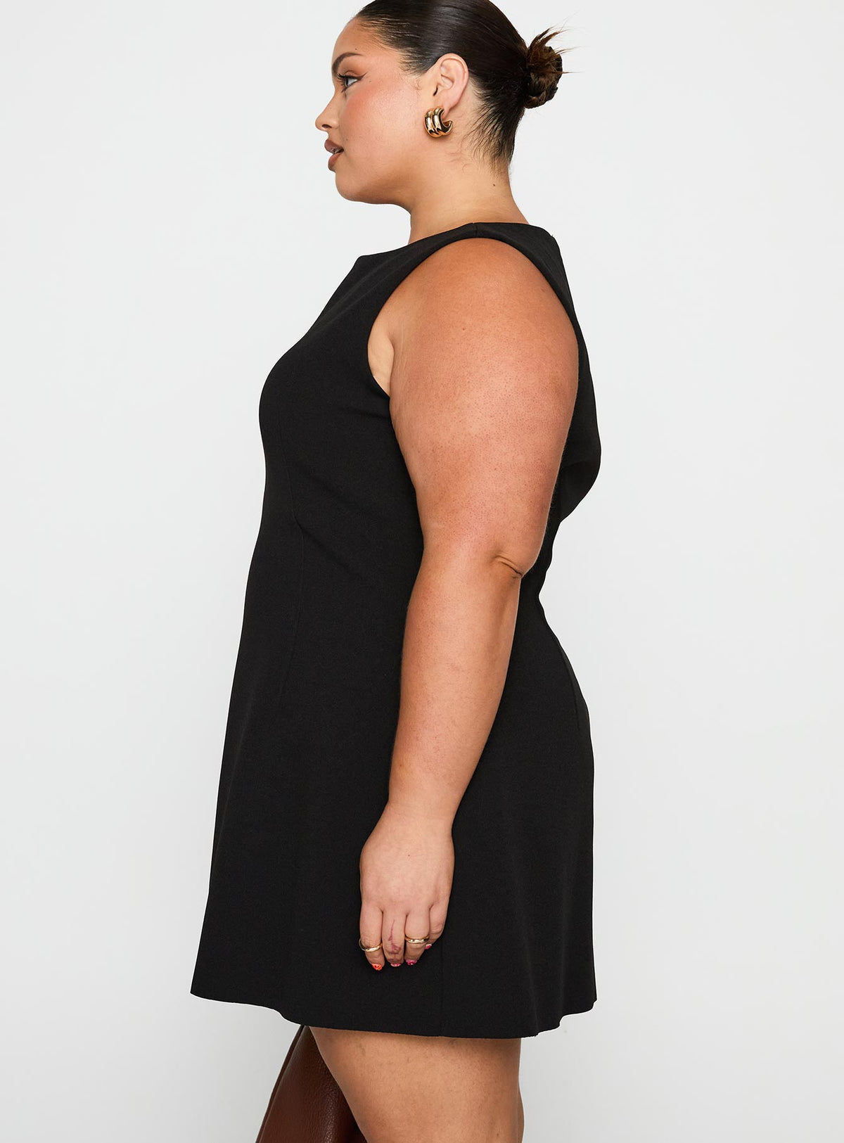side view of model wearing Princess Polly Anse Mini Dress Black Curve Crew Neck 