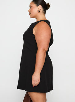 side view of model wearing Princess Polly Anse Mini Dress Black Curve Crew Neck 