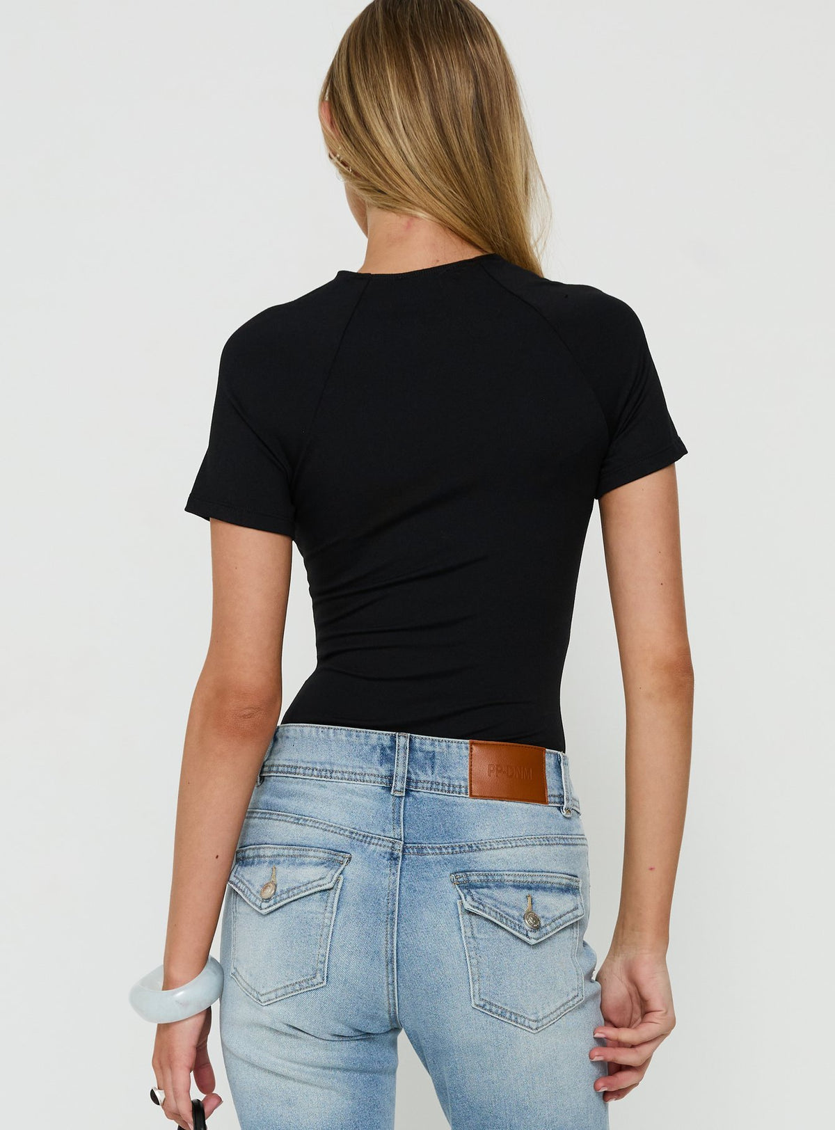 Browse Giallo Solid Bodysuit Black in womens bodysuit with short sleeves back view of model wearing Princess Polly