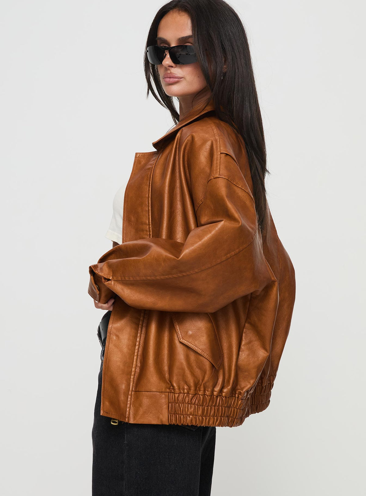 Faux leather bomber jacket Classic collar, zip & button fastening down front, twin hip pockets with press button fastening, elasticated waistband, single button cuff Non-stretch material, fully lined