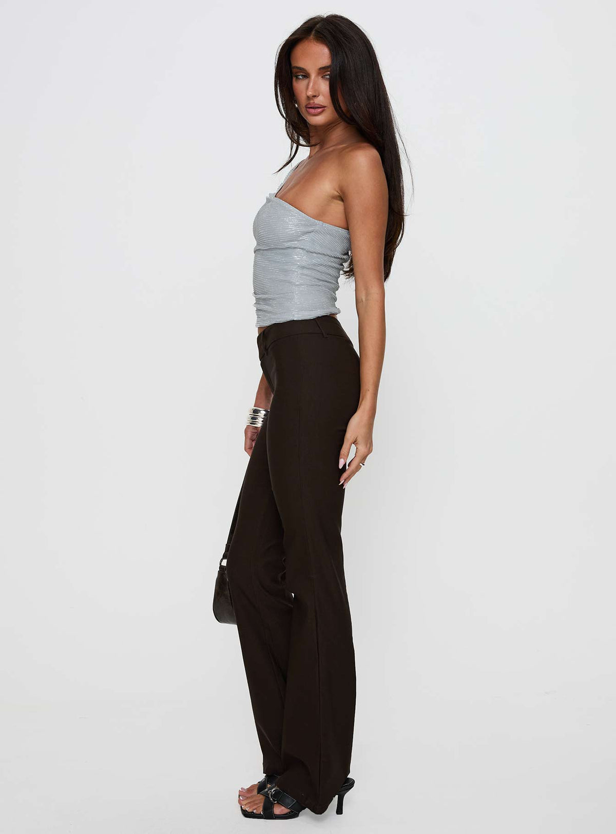 side view of model wearing Princess Polly Kinkirk Flared Pants Chocolate Tall Low Rise Pants Pants 