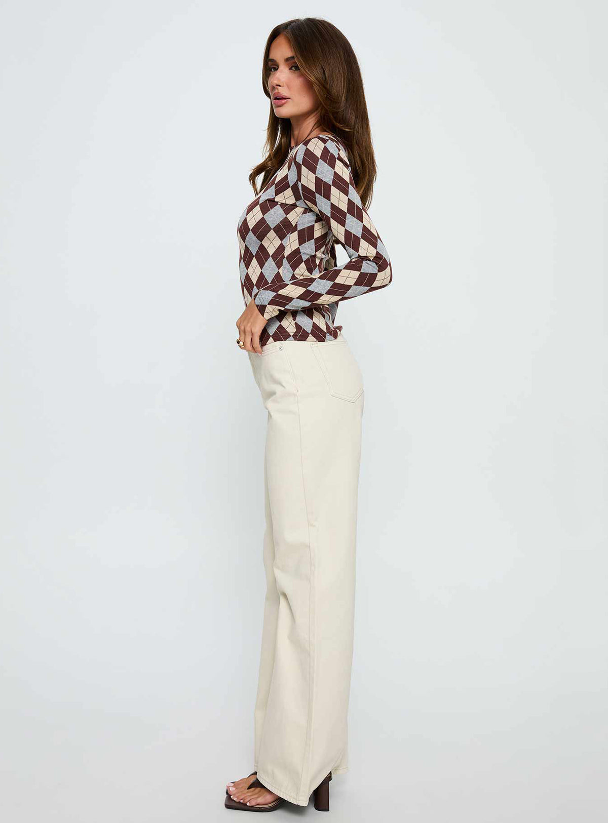 side view of model wearing Princess Polly Maple Mid Rise Flare Jeans Ecru High Rise Jeans Jeans 