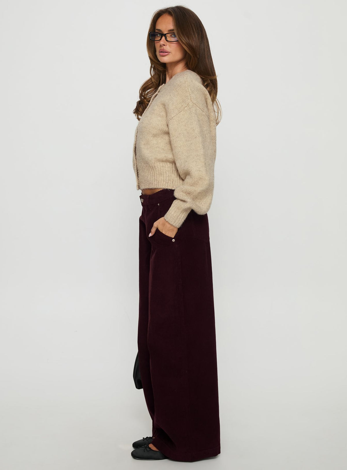 side view of model wearing Princess Polly Jacynda Low Waist Wide Leg Corduroy Jeans Currant Mid Rise Jeans Jeans 