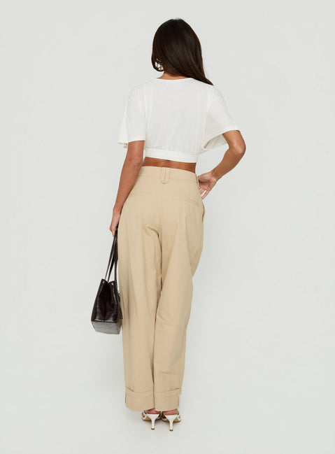 Explore the Kendall Pant Sand womens-regular-pants featuring high-rise pleated wide-leg styling back view of model wearing