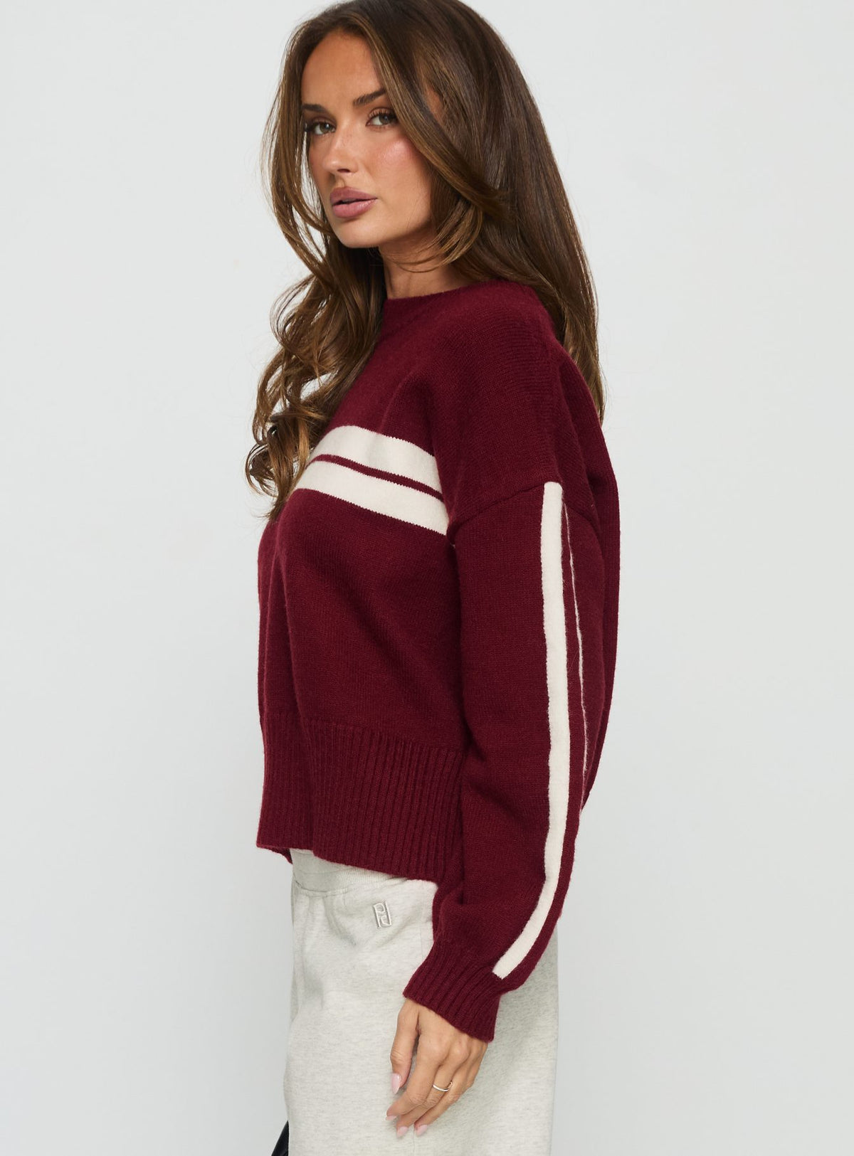 side view of model wearing Princess Polly Catherin Crew Neck Knit Sweater Red / White Cropped Jumpers Jumpers 