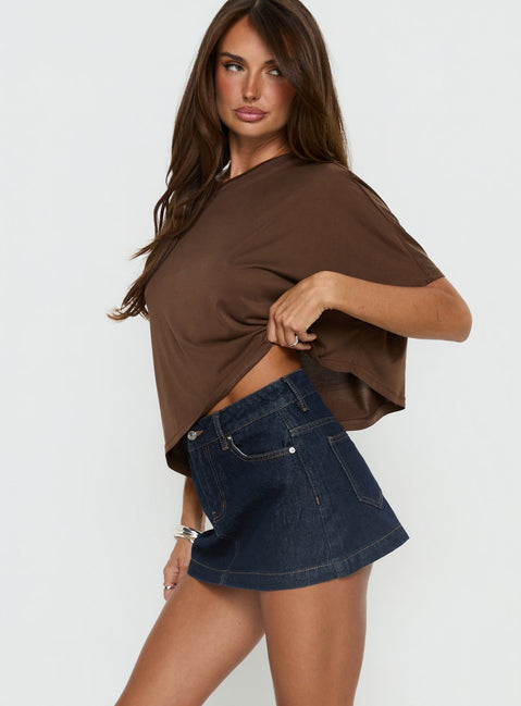   side view of model wearing Princess Polly Nicolina Low Rise Denim Mini Skirt Raw Denim Mini Skirts Skirts 
