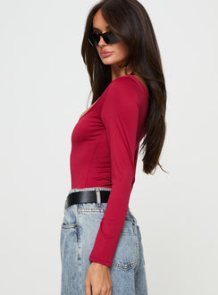 side view of model wearing Princess Polly Ellery Bodysuit Red Long Sleeve Tops Bodysuit 