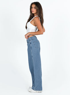 side view of model wearing Princess Polly Maryanne Mid Rise Relaxed Jeans Mid Wash Denim Tall Mid Rise Jeans Jeans 