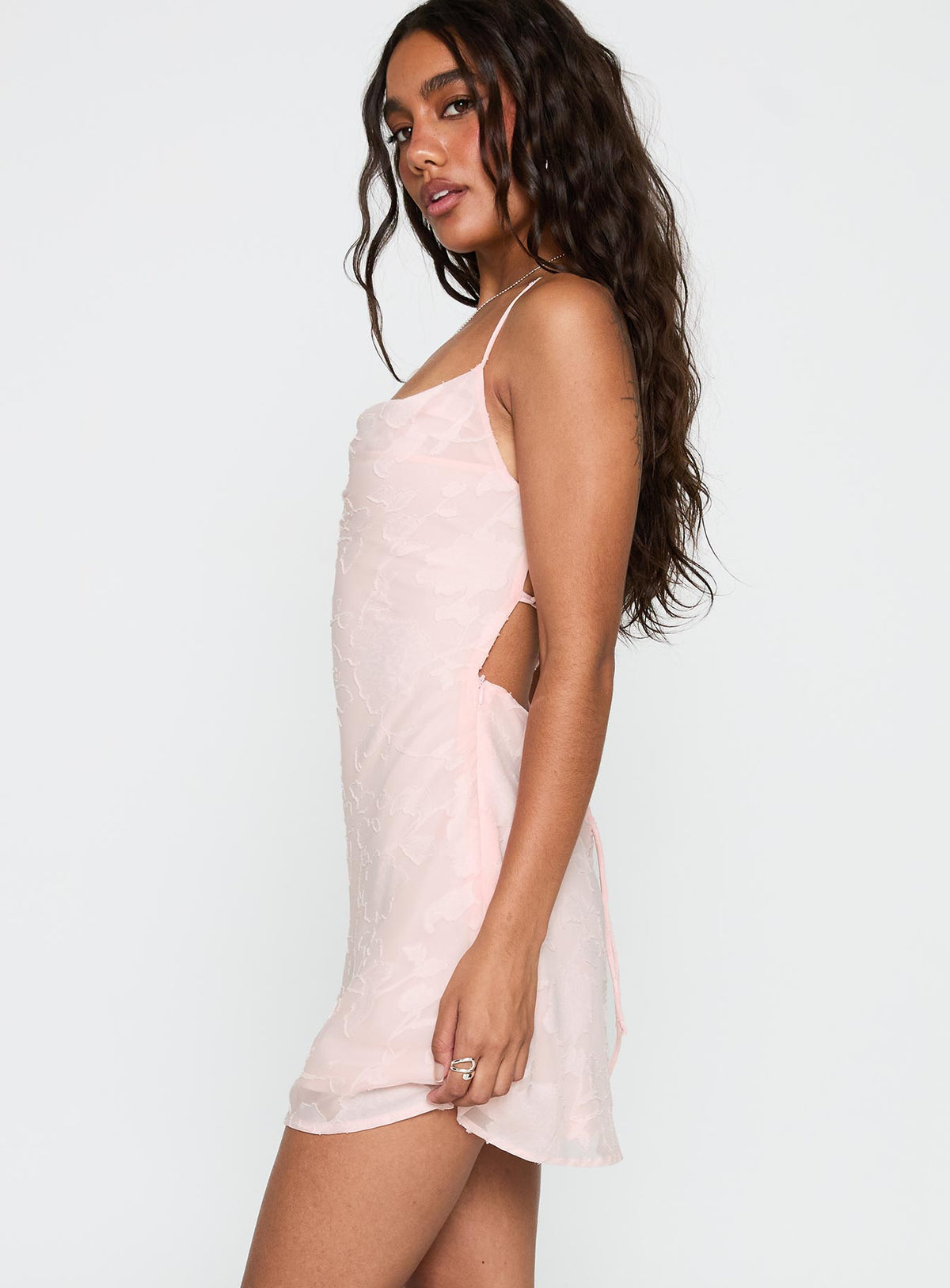 side view of model wearing Princess Polly Celena Mini Dress Pink Burnout Cowl Neck 