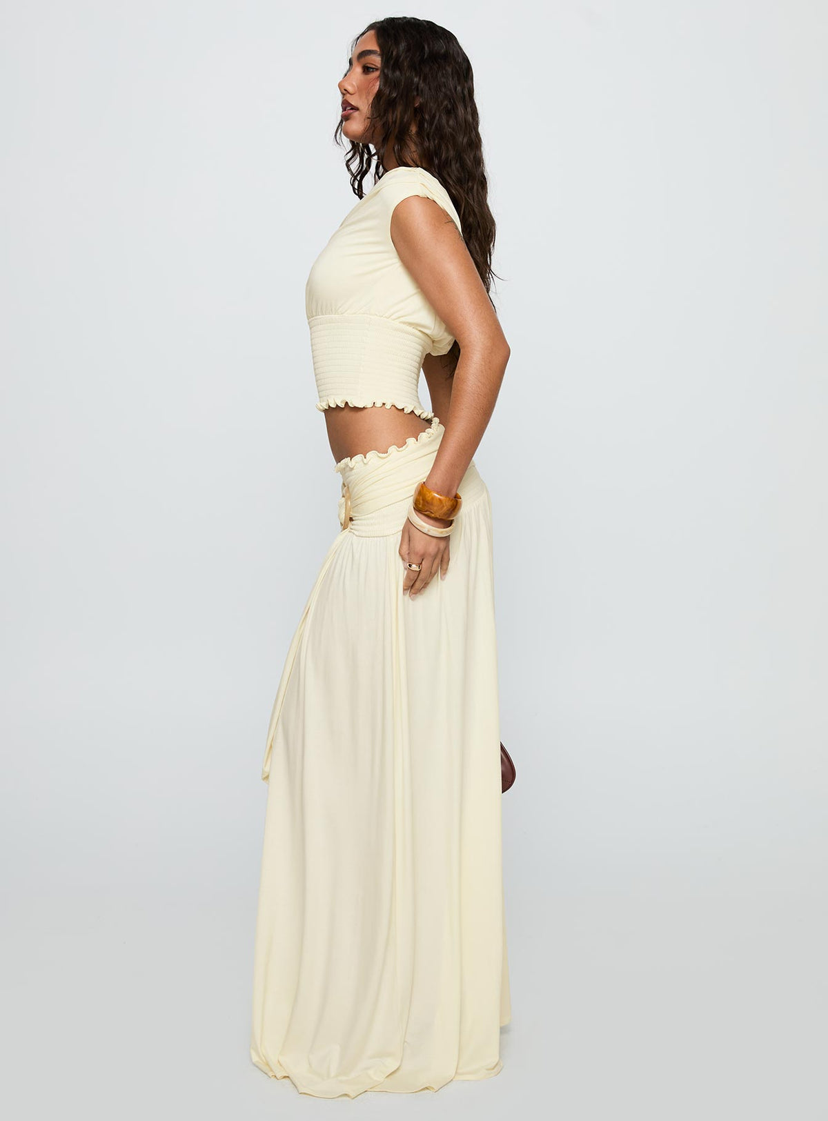   side view of model wearing Princess Polly Full Orbit Shirred Maxi Skirt Cream Maxi Skirts Skirts 