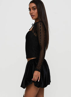   side view of model wearing Princess Polly Georgiana Bubble Hem Mini Skirt Black Mini Skirts Skirts 