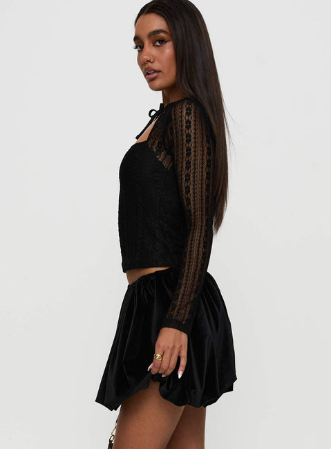   side view of model wearing Princess Polly Georgiana Bubble Hem Mini Skirt Black Mini Skirts Skirts 