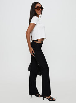 side view of model wearing Princess Polly Eyes On You Flare Pants Black High Rise Pants Pants 